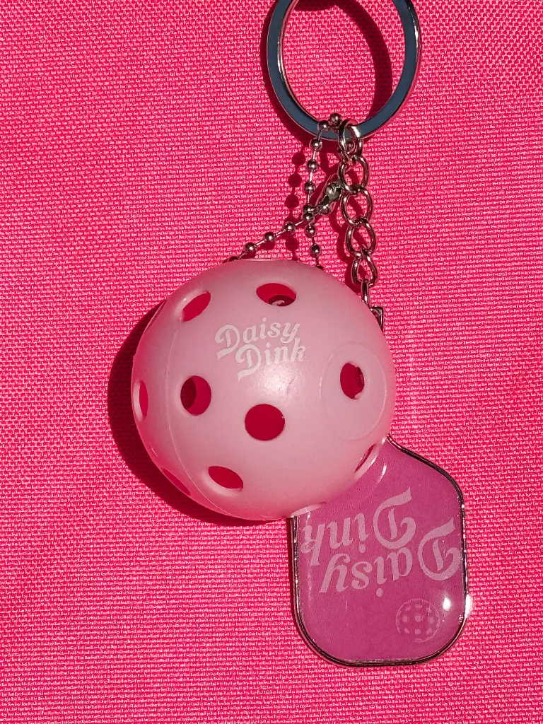 Daisy Dink Pickleball Keychain Hanging from bag